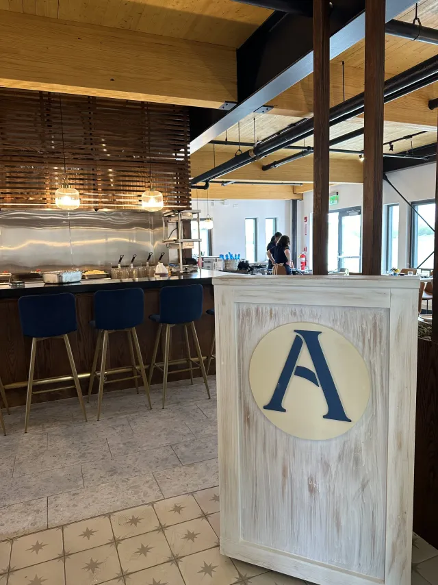 Aire &ldquo;A&rdquo; monogram sign in front of the kitchen counter